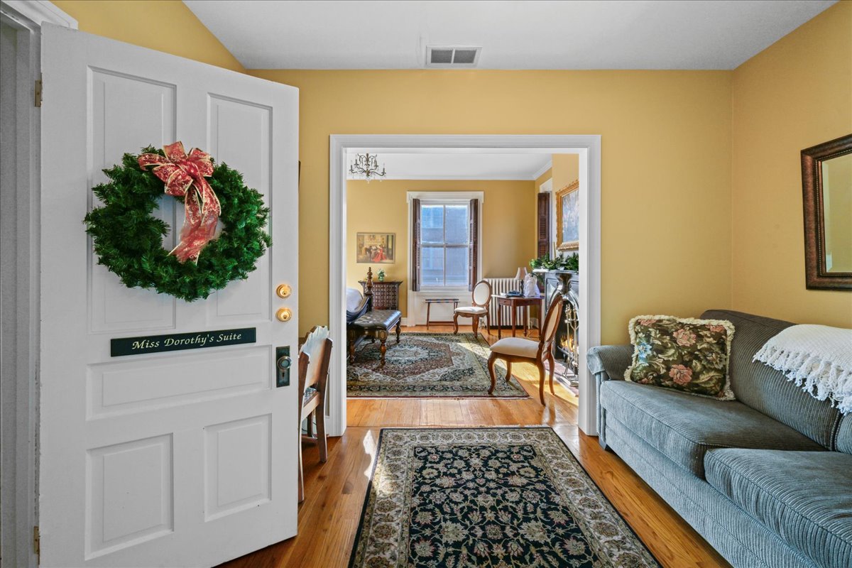 The Miss Dorothy Suite also features a secondary sitting room with a sleeper sofa for 2.  This room also features a desk with chair, and a TV.