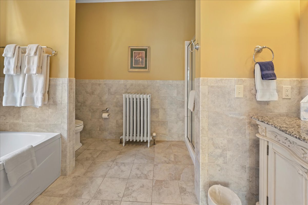 The Miss Dorothy Suite Bathroom includes a jetted tub for 2 and toilet.