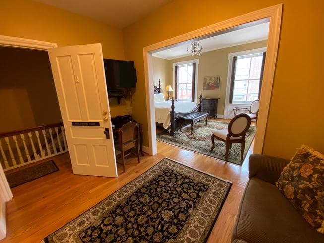 The Miss Dorothy Suite also features a secondary sitting room with a sleeper sofa for 2.  This room also features a desk with chair, and a TV.