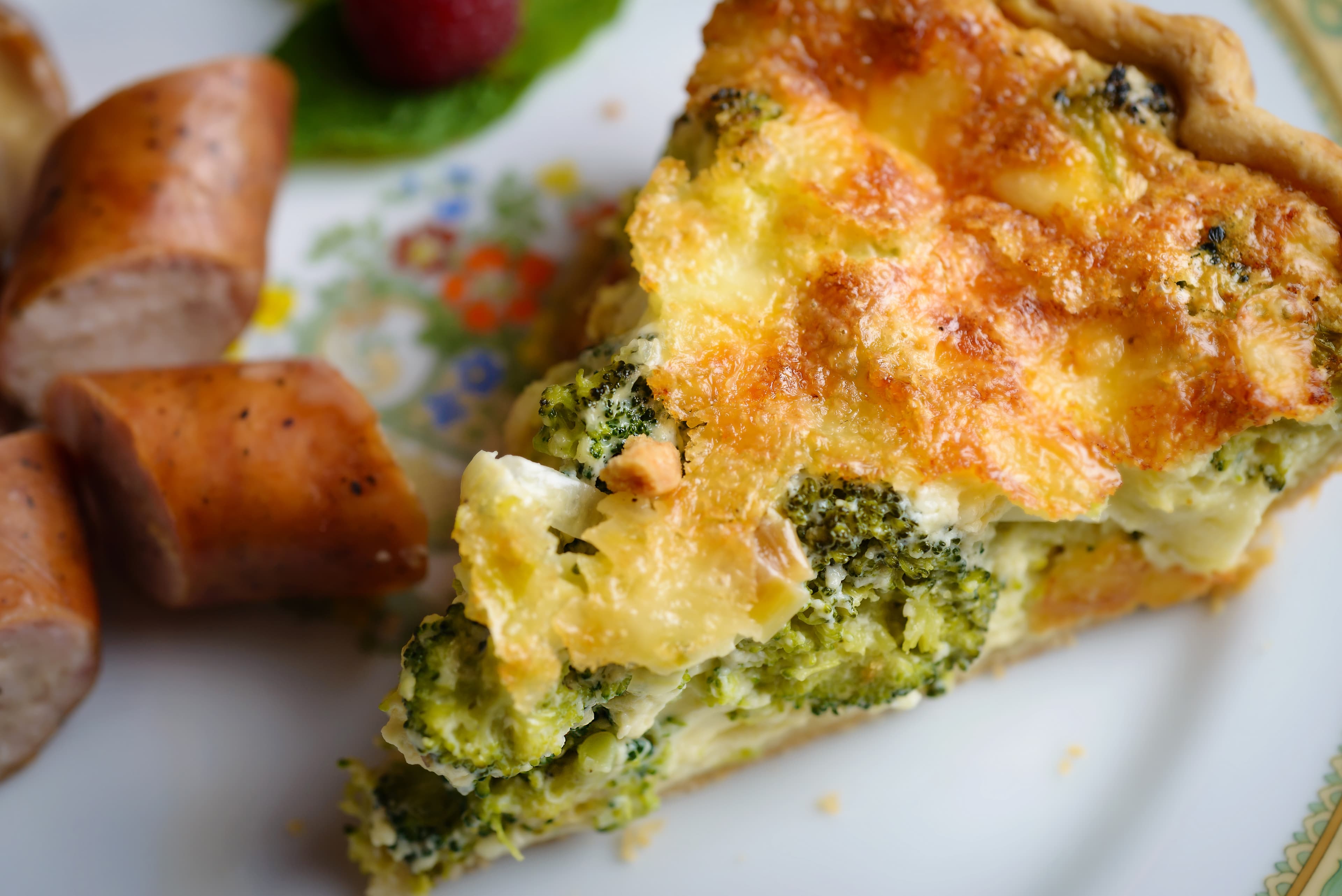 Broccoli cheddar quiche and chicken sausage with apple and gouda