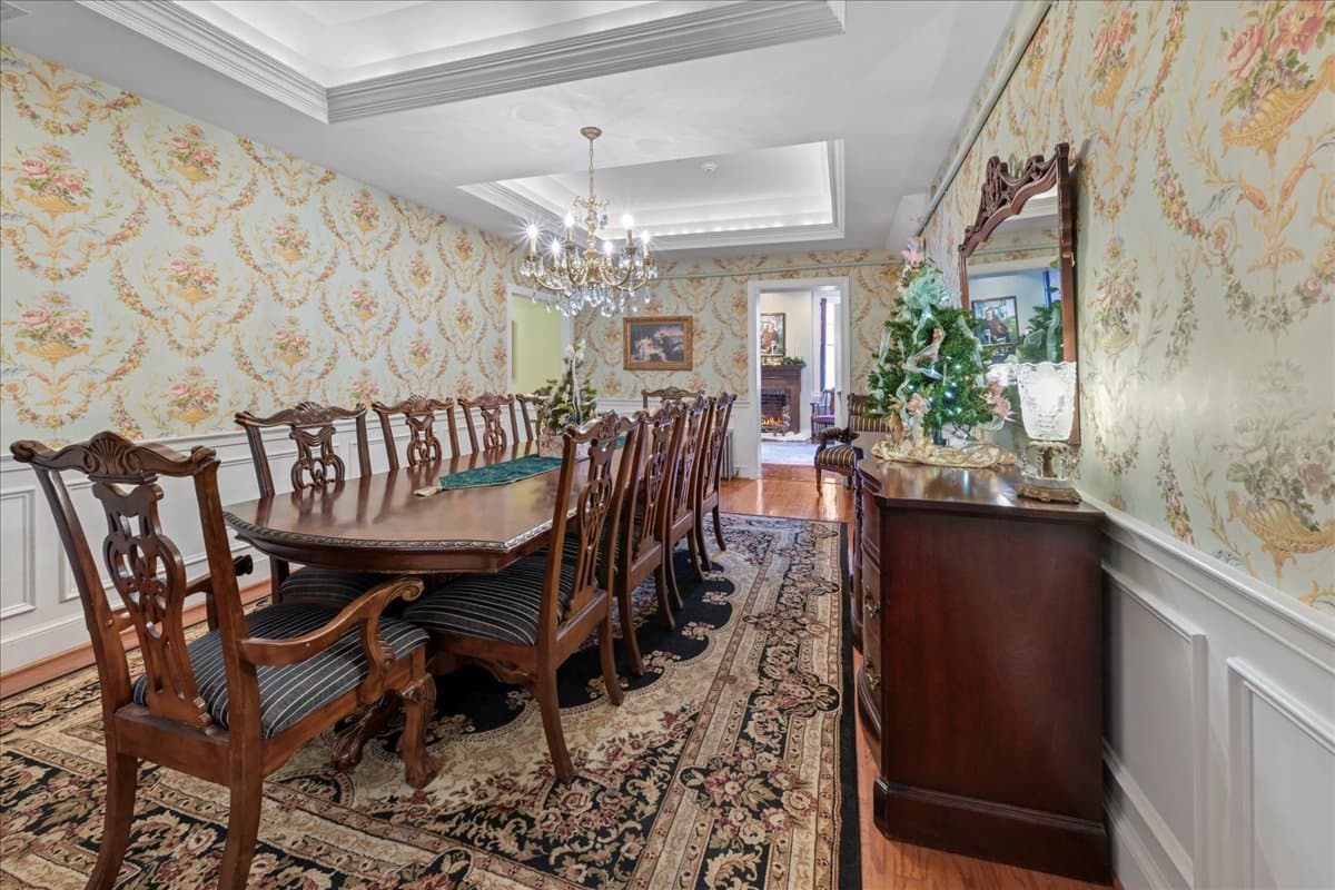 Formal dining room with tray ceiling at Swope Manor
