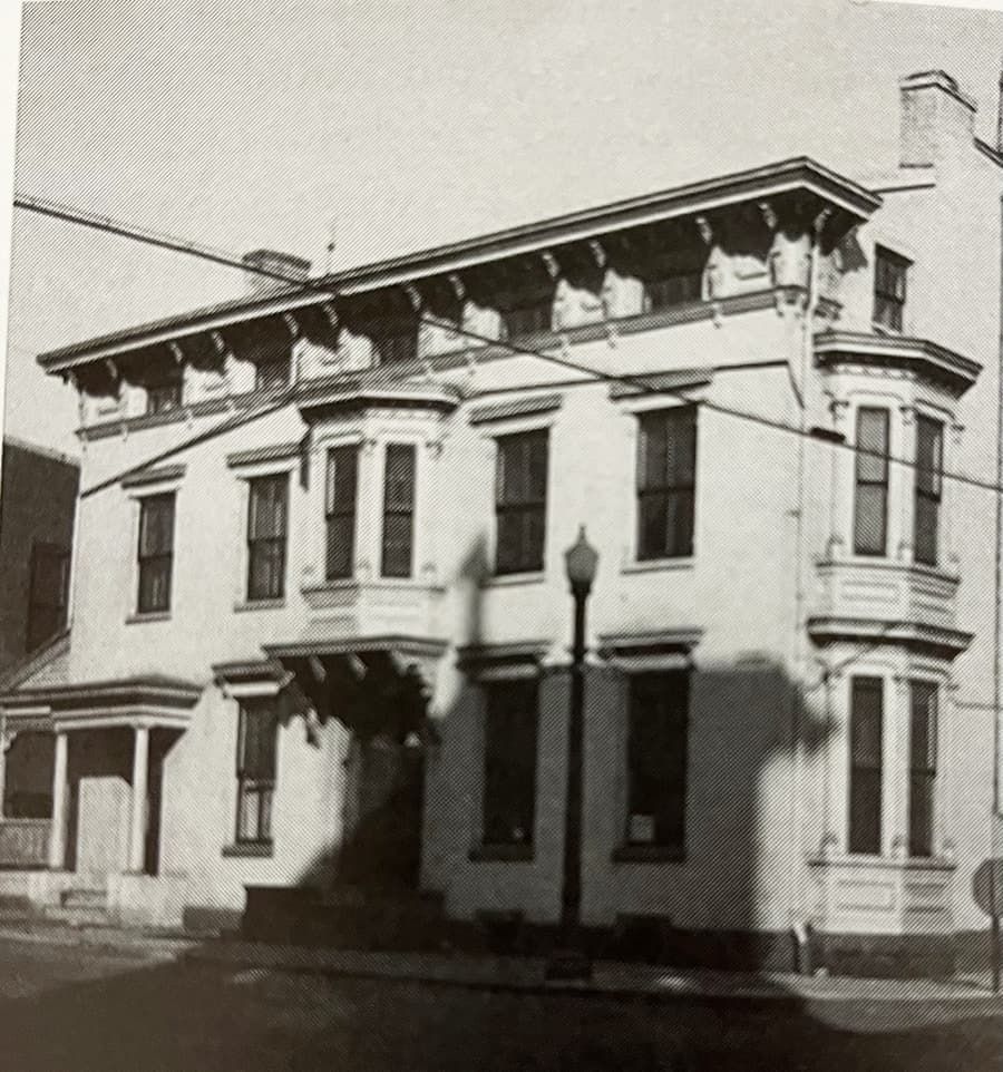 Historic building with multiple windows and ornate architectural details.