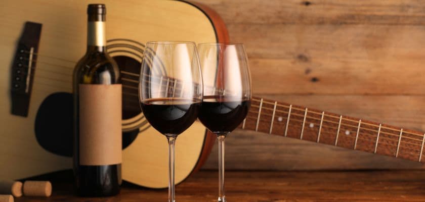 Wine glasses and an acoustic guitar highlight the music and tasting weekends near The Swope Manor.